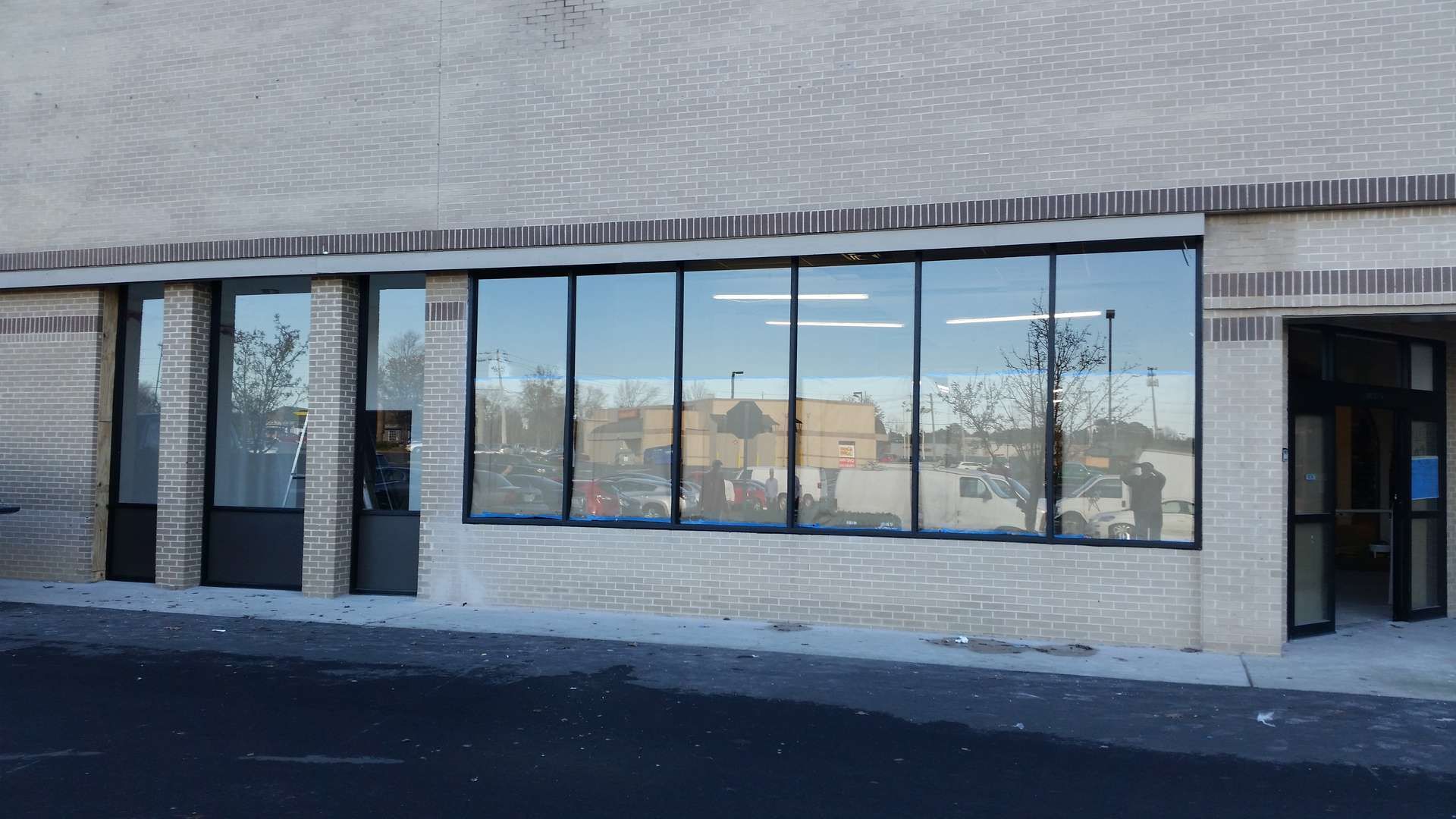 A large building with a lot of windows and a door.