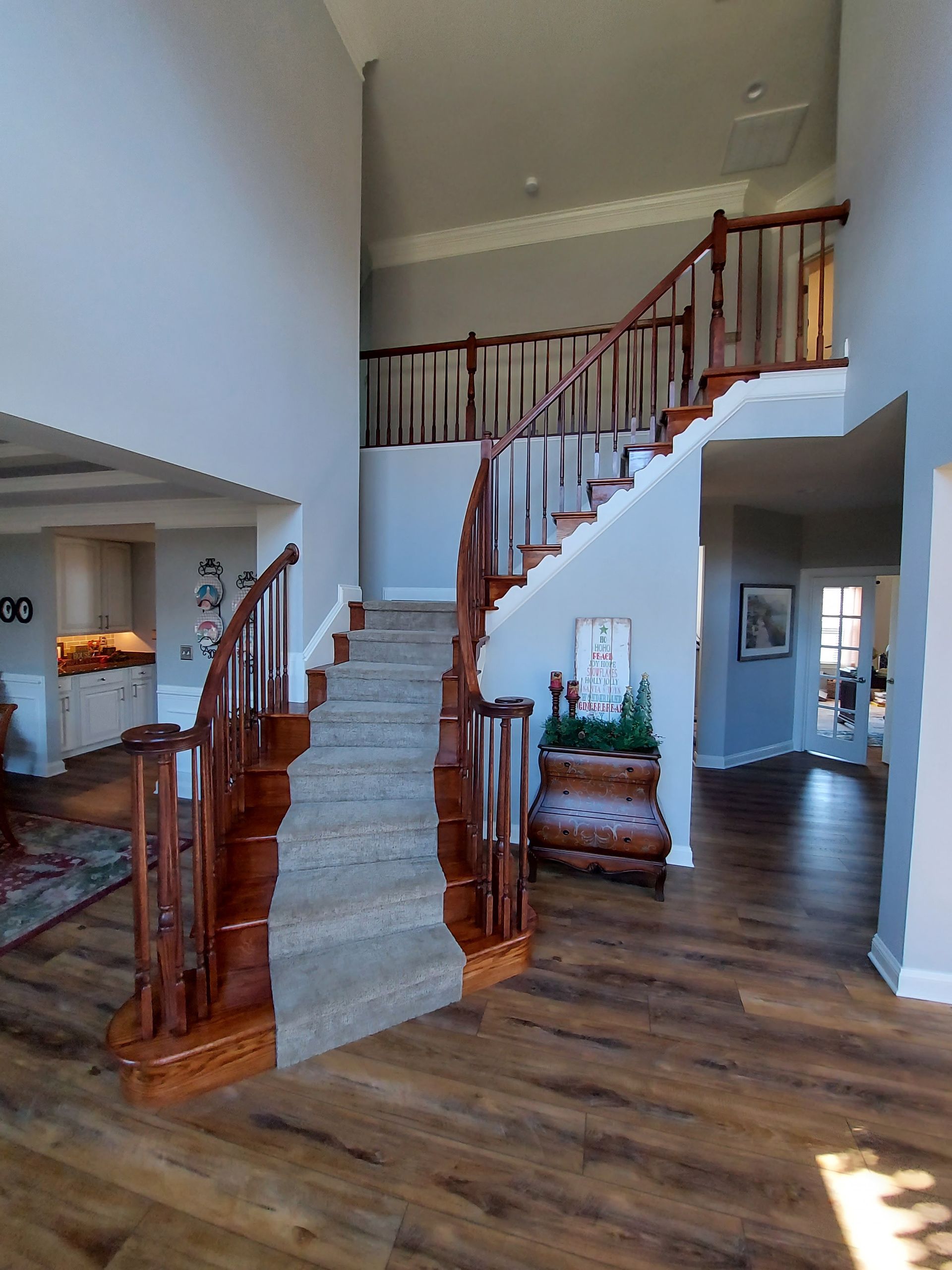A staircase in a house with a wooden railing