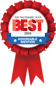 A red ribbon with the words The Baltimore Sun's Best Honorable mention on it.