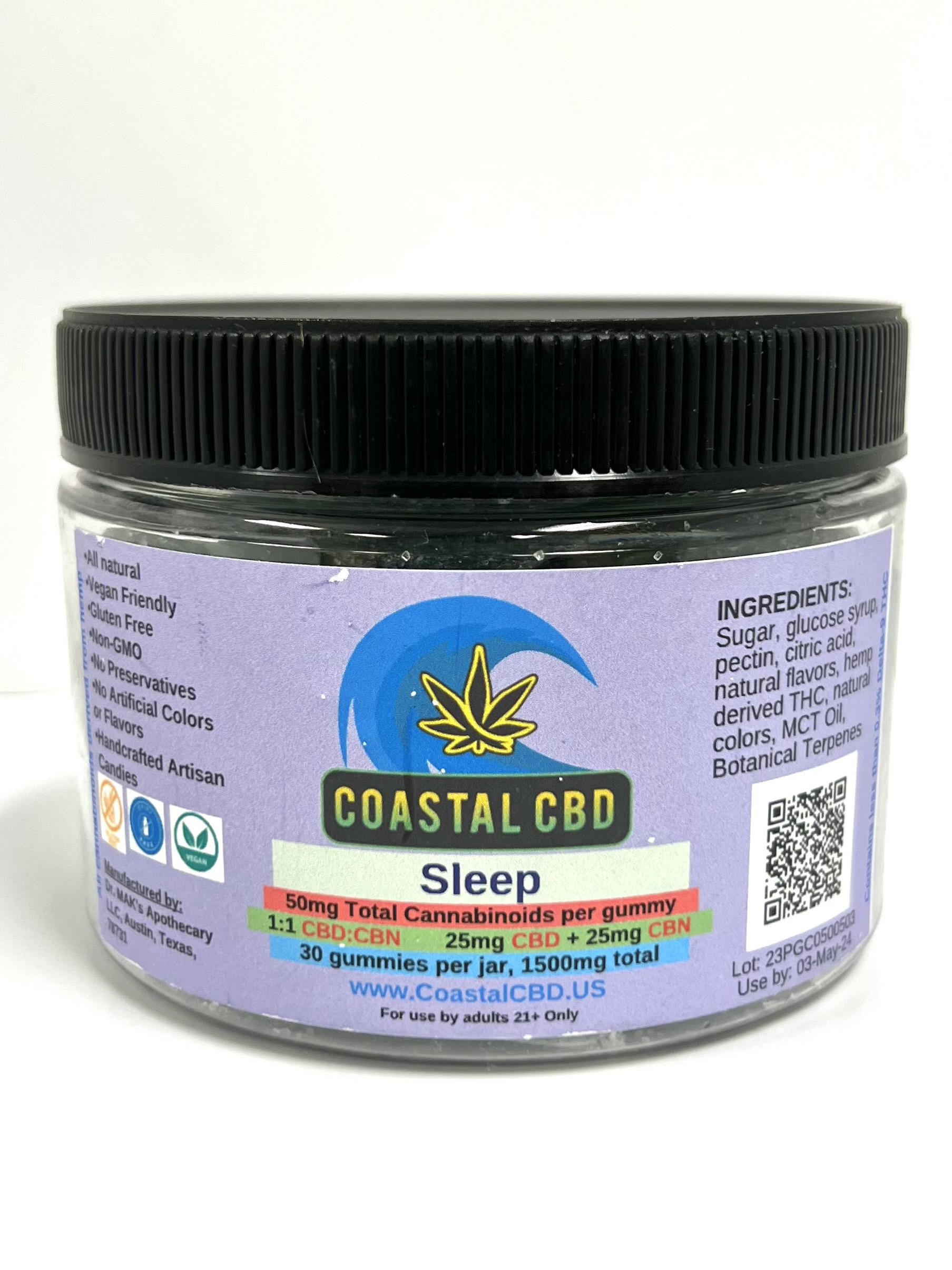 A jar of coastal cbd sleep gummy bears with a black lid.