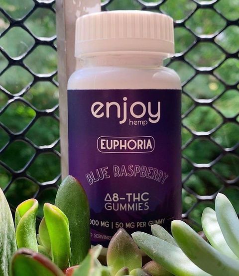 A bottle of enjoy euphoria blue raspberry 48 thc gummies