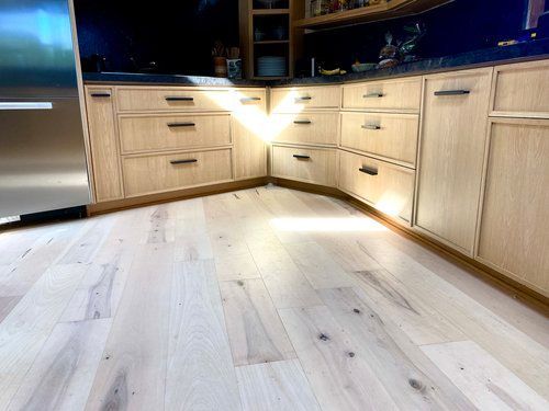 A kitchen with wooden cabinets and stainless steel appliances