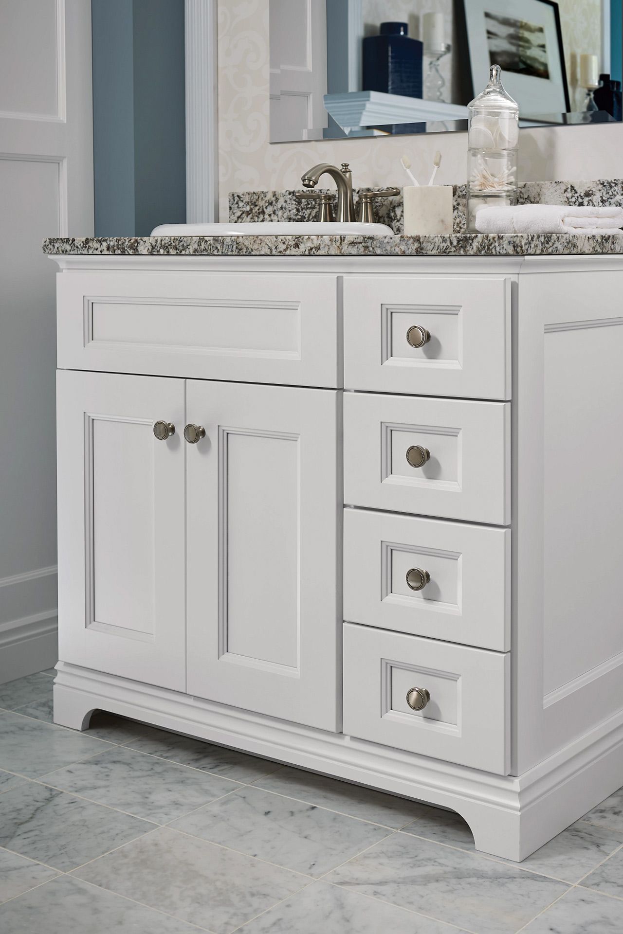A bathroom vanity with a sink and a mirror