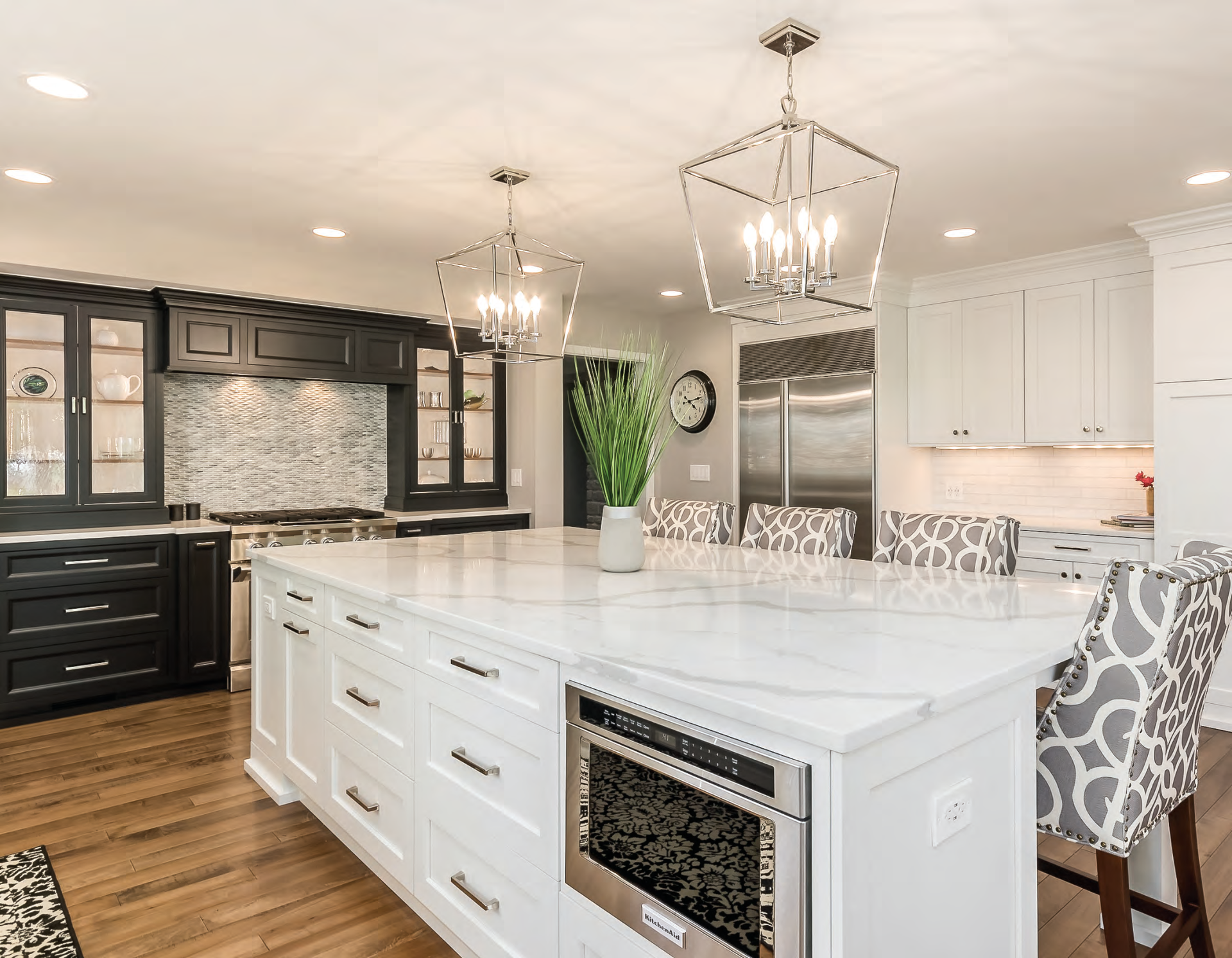 There is a large island in the middle of the kitchen.