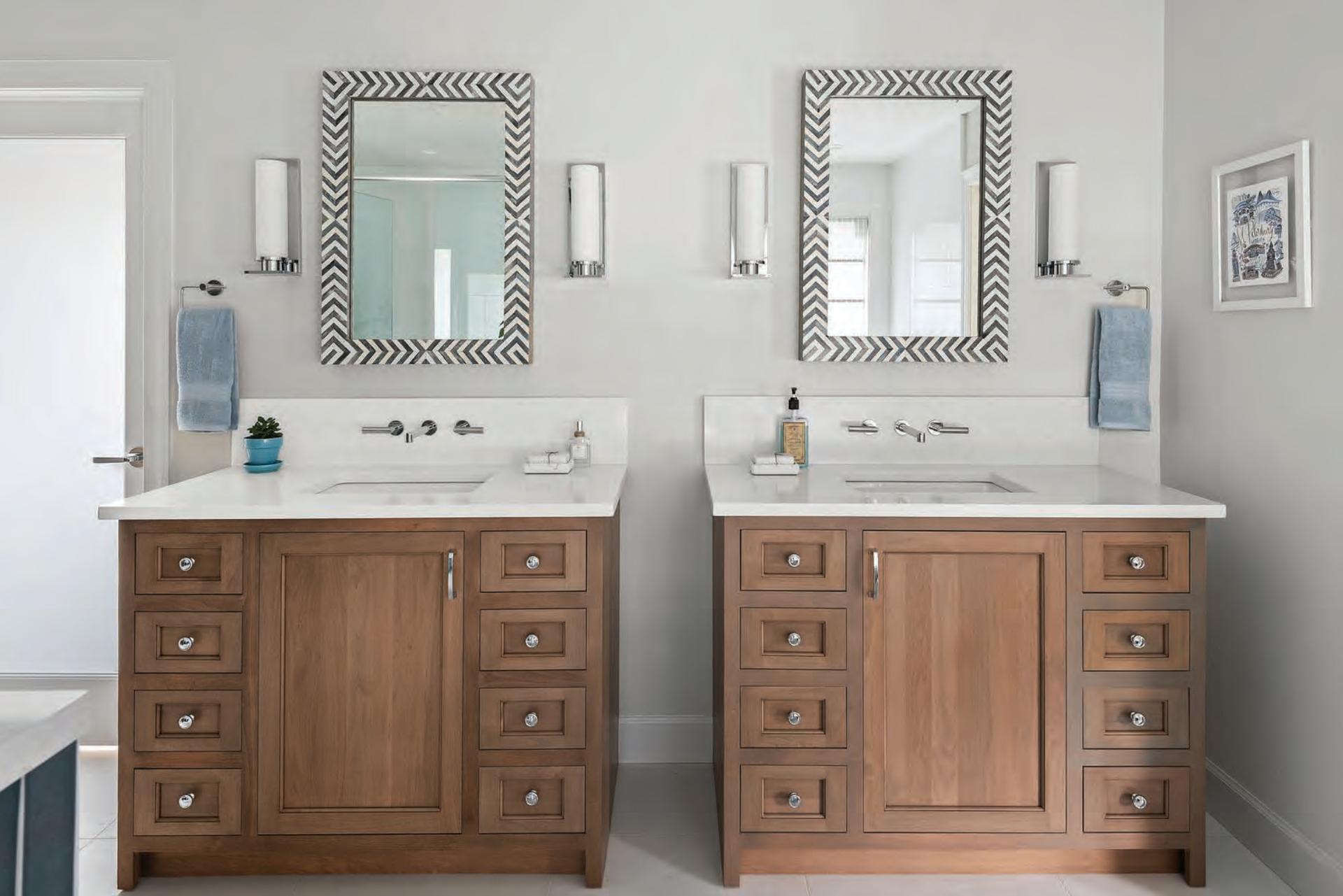 A bathroom with two sinks and two mirrors.