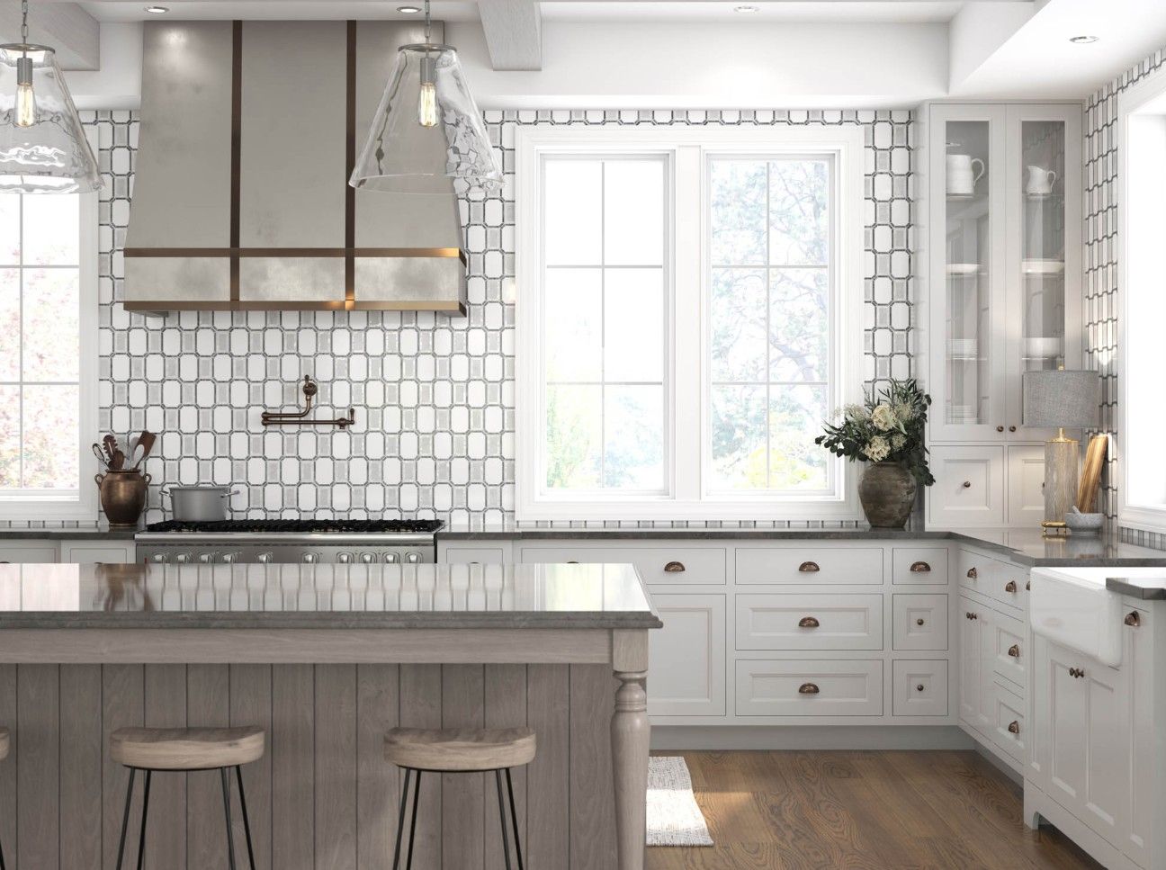 Bright modern kitchen featuring white cabinets, a large island with two stools, patterned backsplash, and window view.