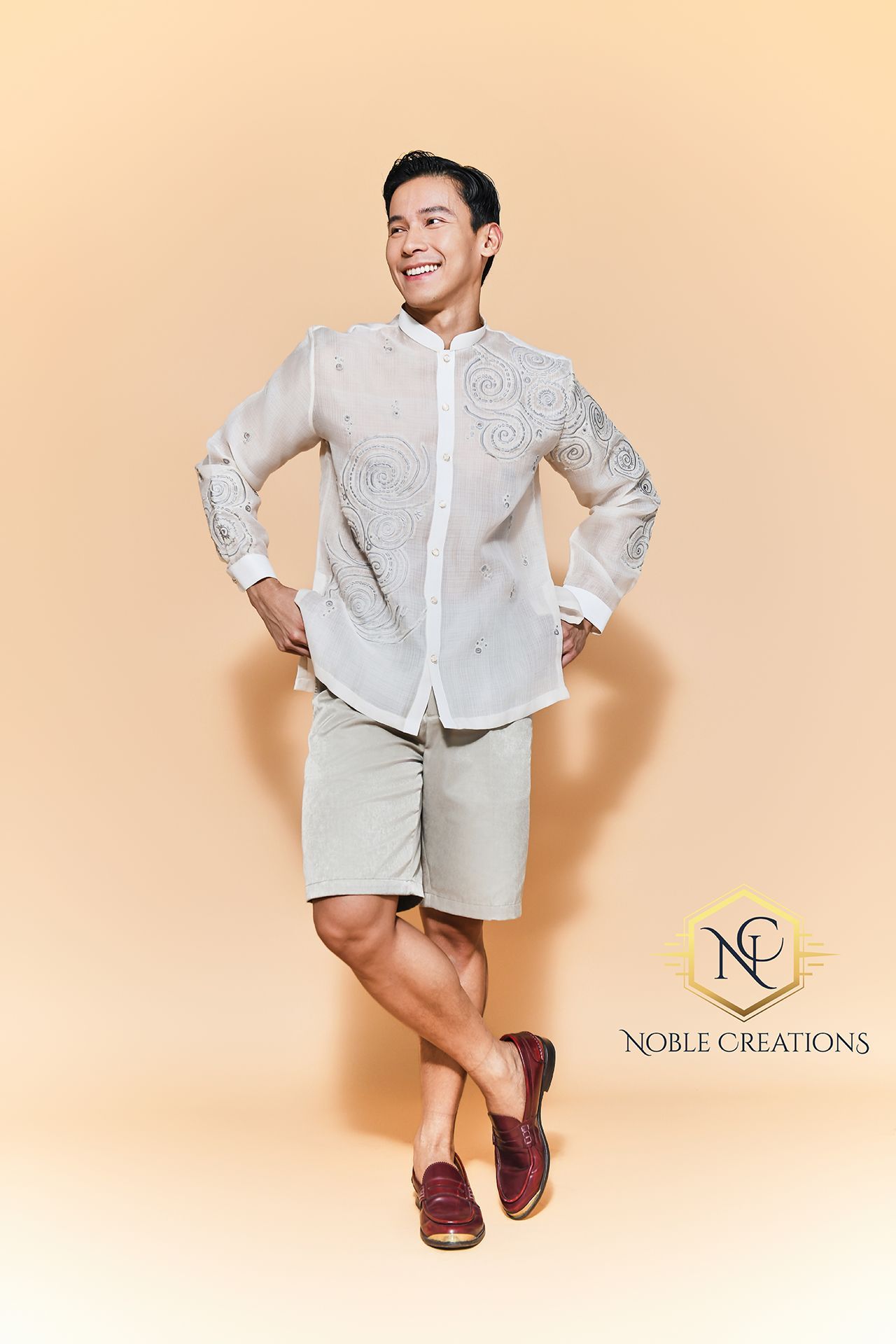 Man in a barong and shorts