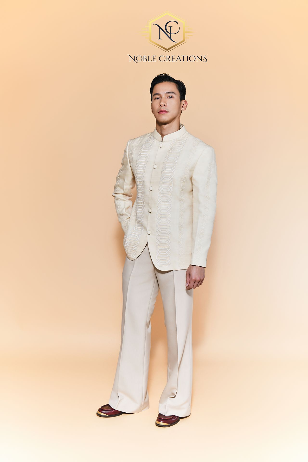 Man wearing a beautiful barong with cream pants