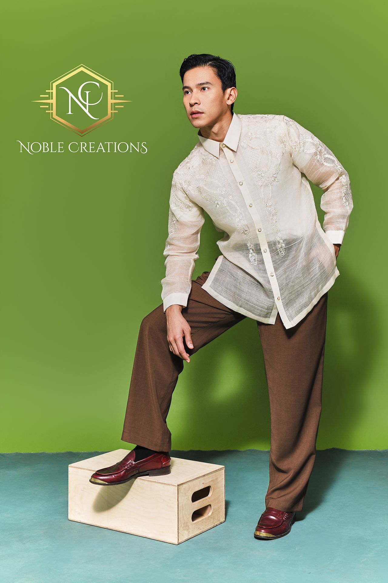 Man wearing a barong and brown pants