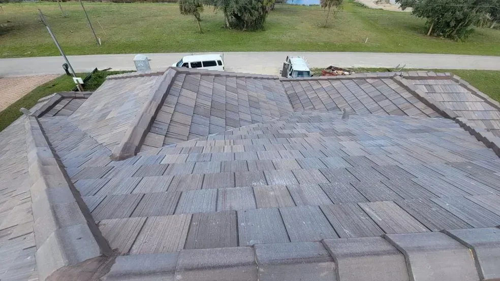 A roof with a lot of tiles on it is being built.