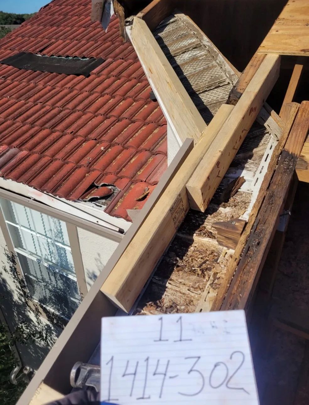 A roof with a sign that says 1441-302 on it