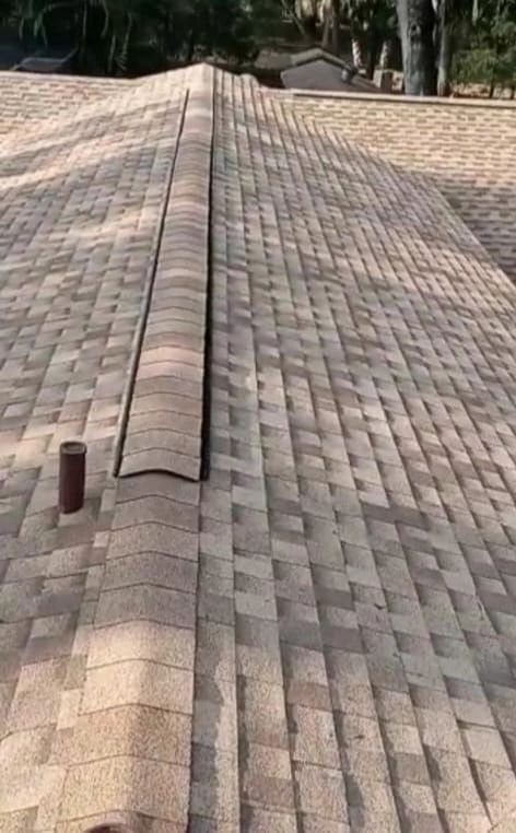 A close up of a roof with shingles on it.