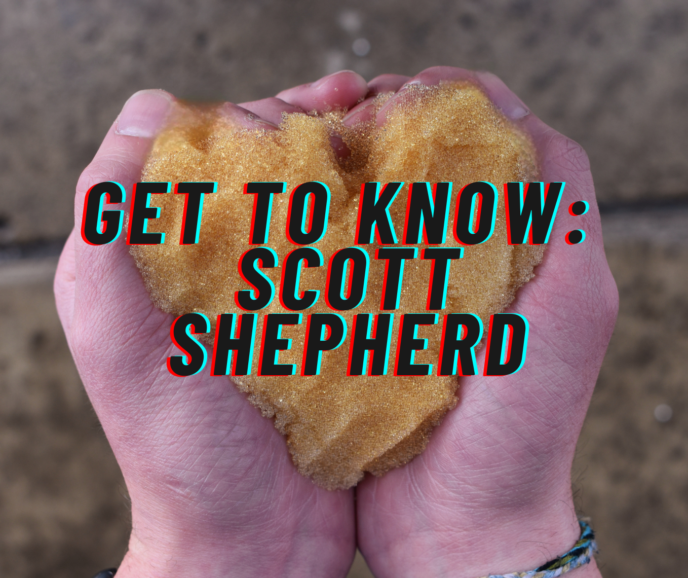 A person holding a heart shaped object with the words get to know scott shepherd below it