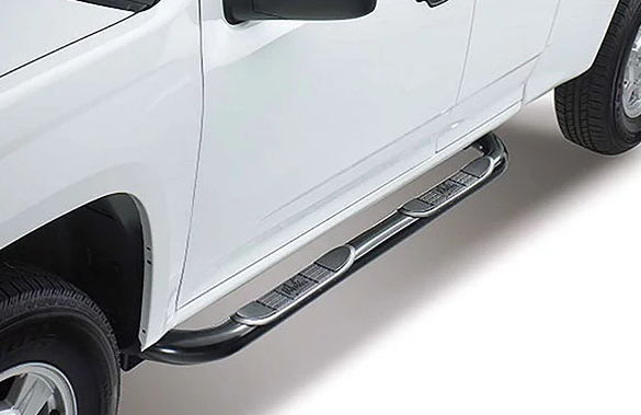 White pickup truck with chrome running boards.