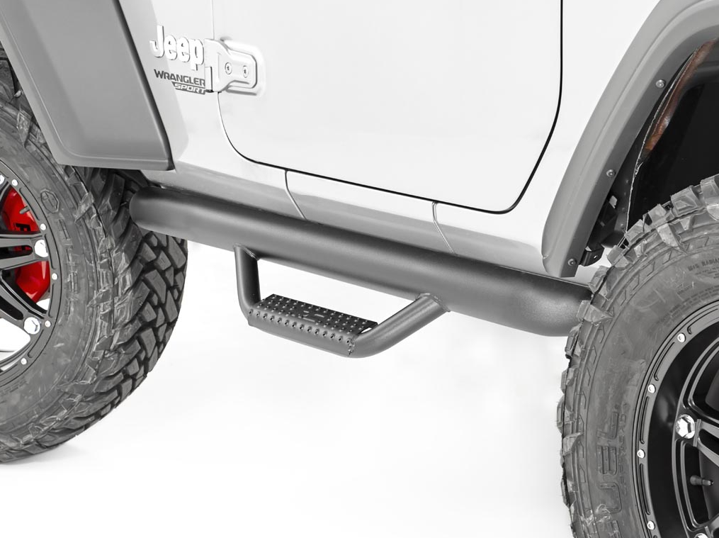 Black side step attached to a silver Jeep with large tires and red brake calipers.