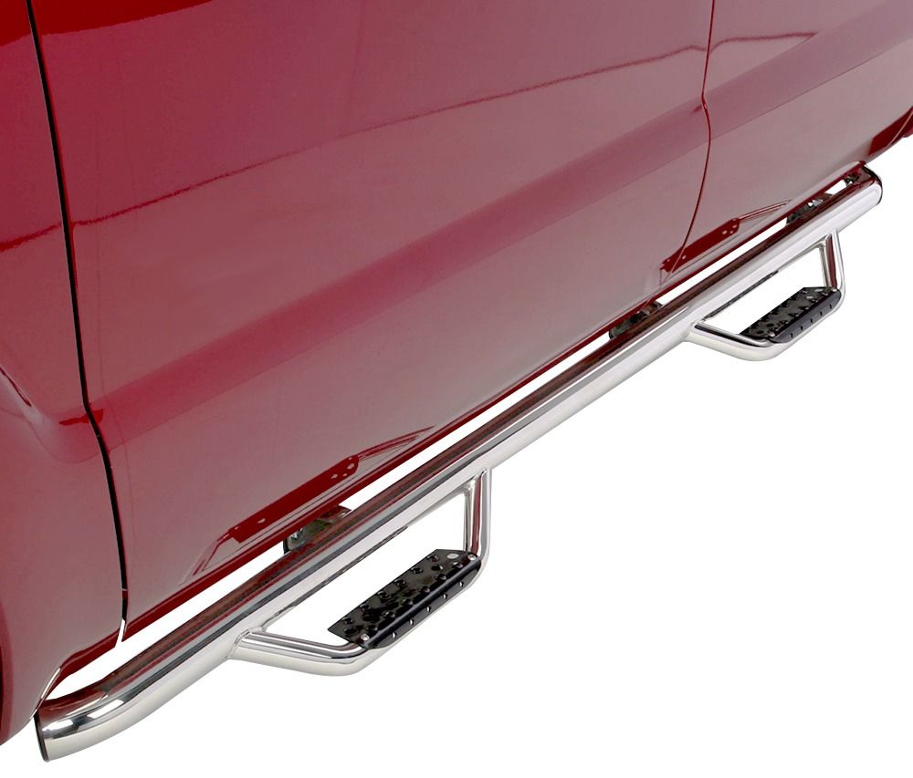 Shiny chrome side steps attached to a red truck door, providing a step-up for passengers.