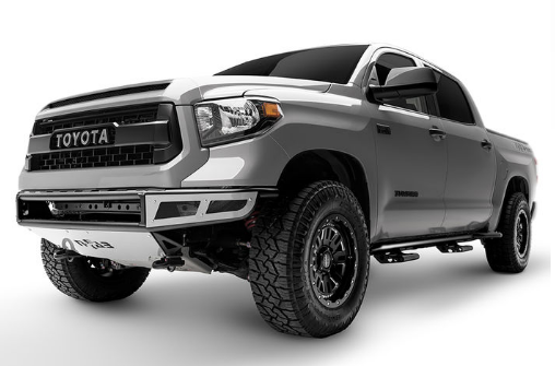 Gray Toyota Tundra truck with modified front bumper and off-road tires, angled slightly towards the viewer.