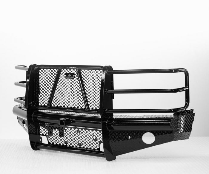 Black metal truck bumper with a mesh grille and side guards.