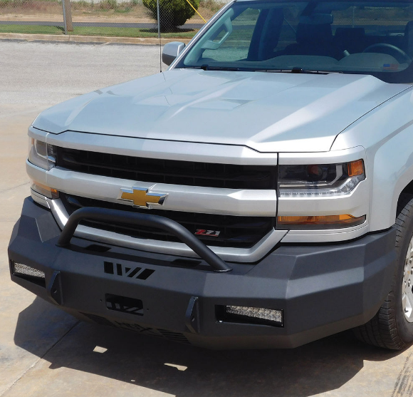 Silver Chevy pickup truck with a black custom bumper and bull bar.