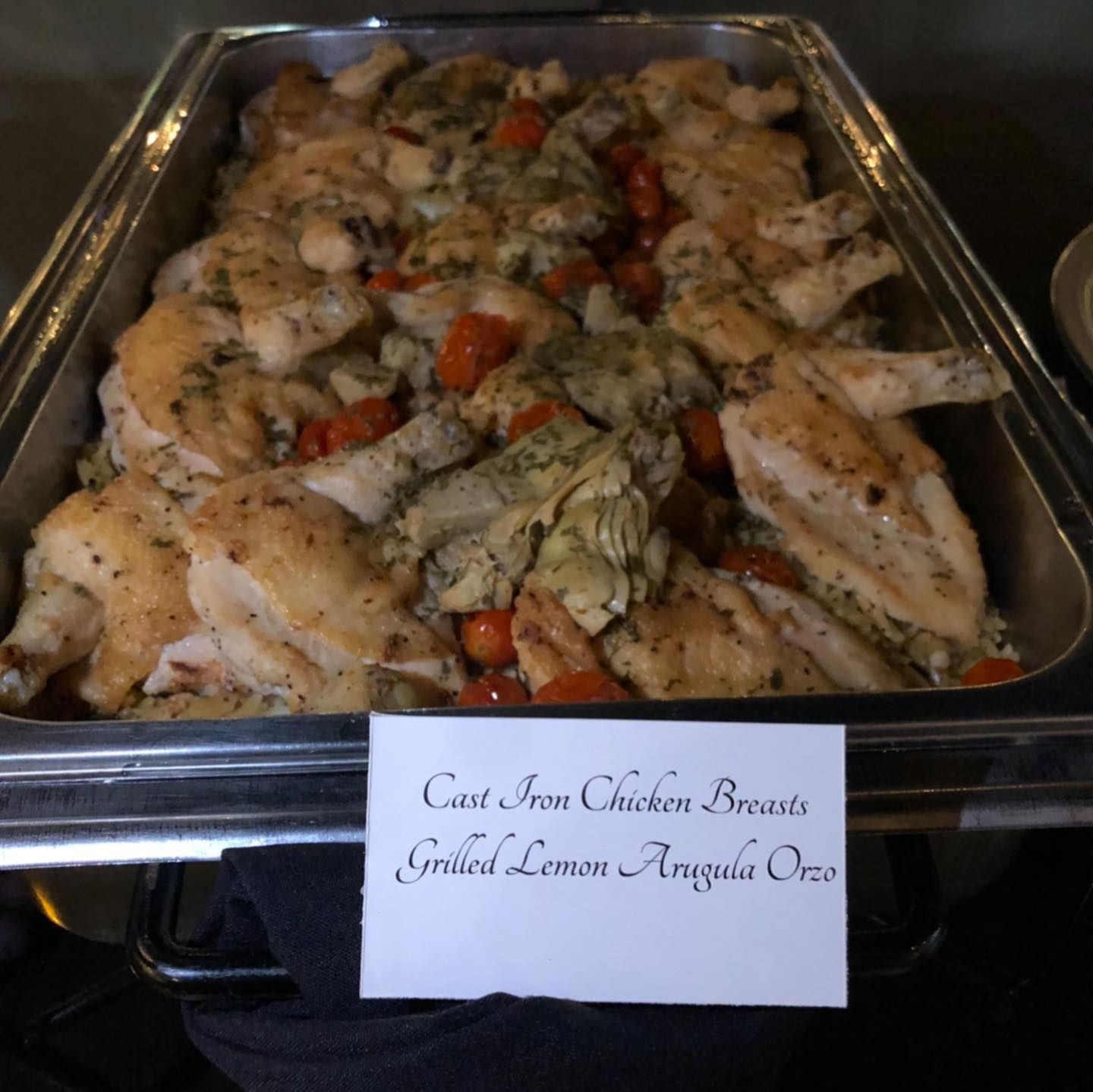 A tray of grilled lemon angus chicken breasts.