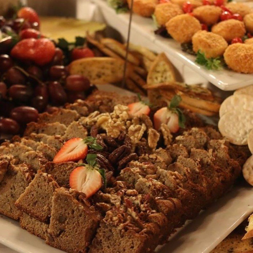 A plate of food with strawberries and nuts on it.