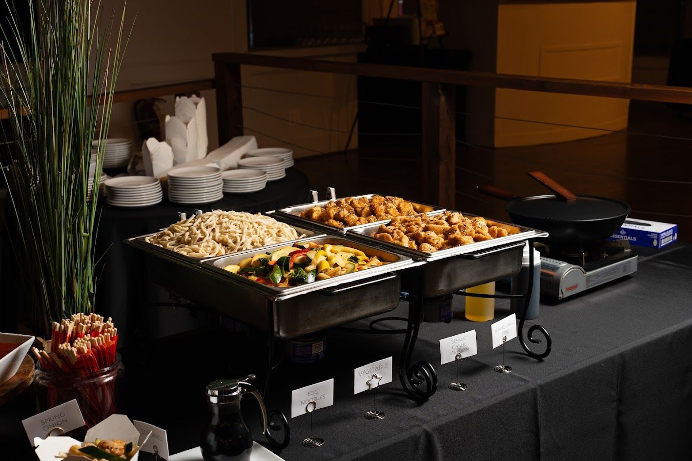 A buffet table with a variety of food on it.