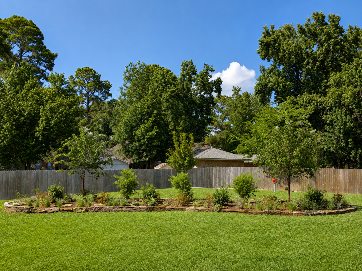 Before and after of a concrete pathway transformation. Replaced with stone and landscaping.