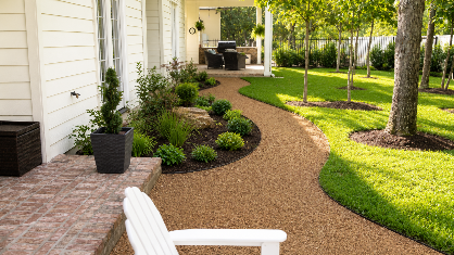 Side-by-side comparison: before (left) and after (right) gravel pathway. The "after" pathway is bordered by black mulch and plants.
