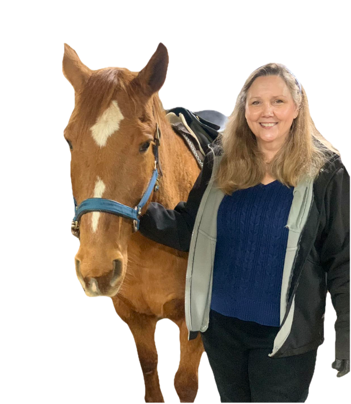 Woman in blue top and black jacket next to a brown horse with a white diamond on its forehead.