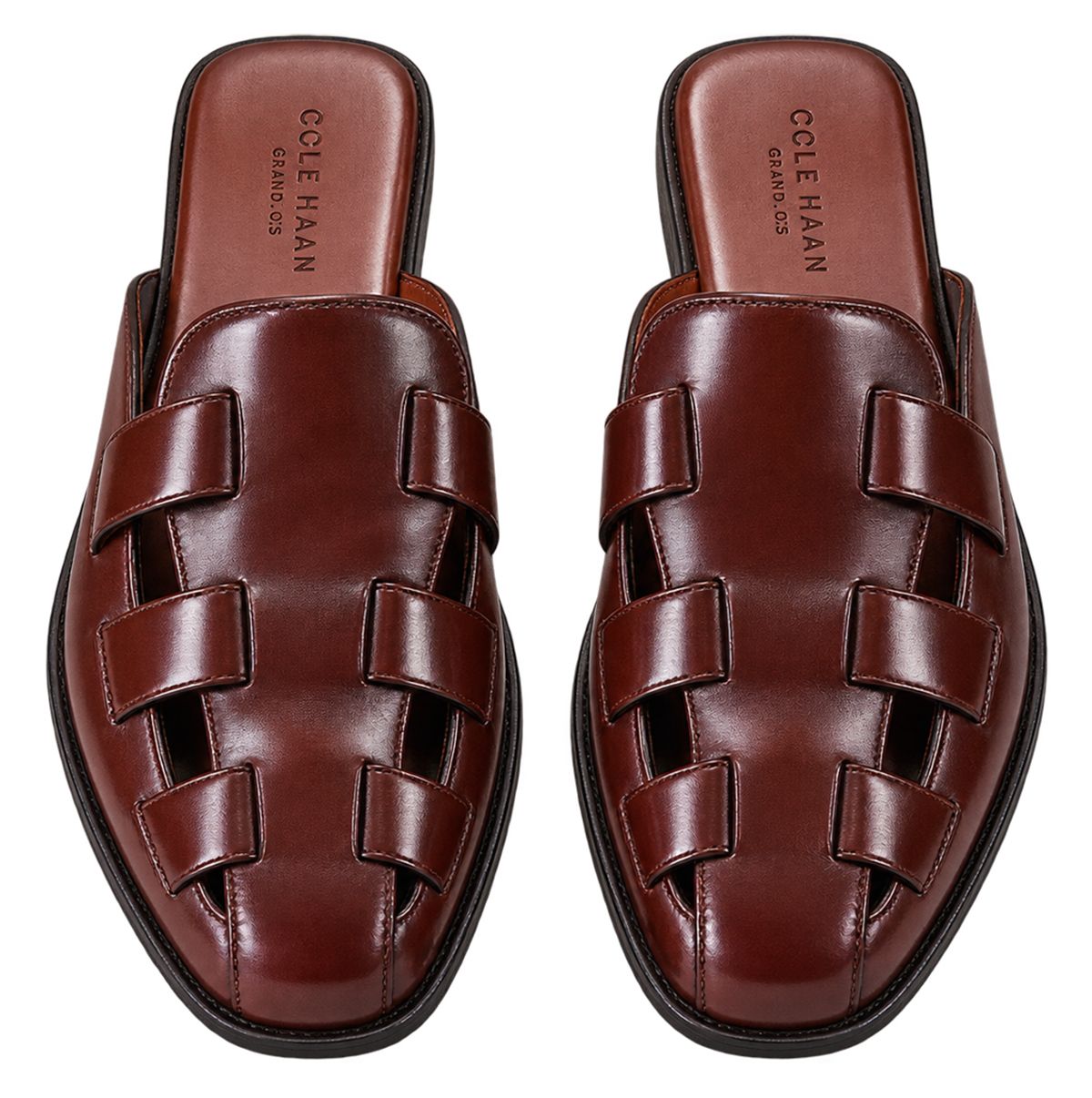 Pair of burgundy woven leather loafers on a white background