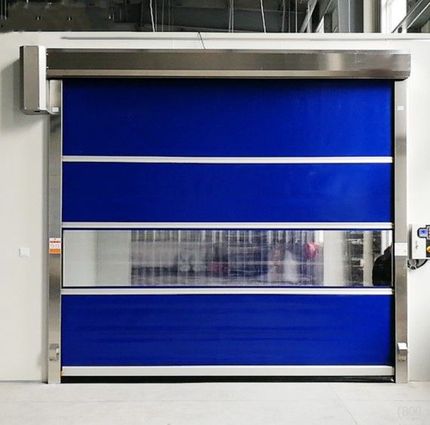 Blue industrial roll-up door with a narrow transparent window in the center