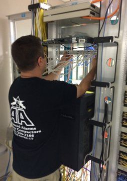 Man installing security system