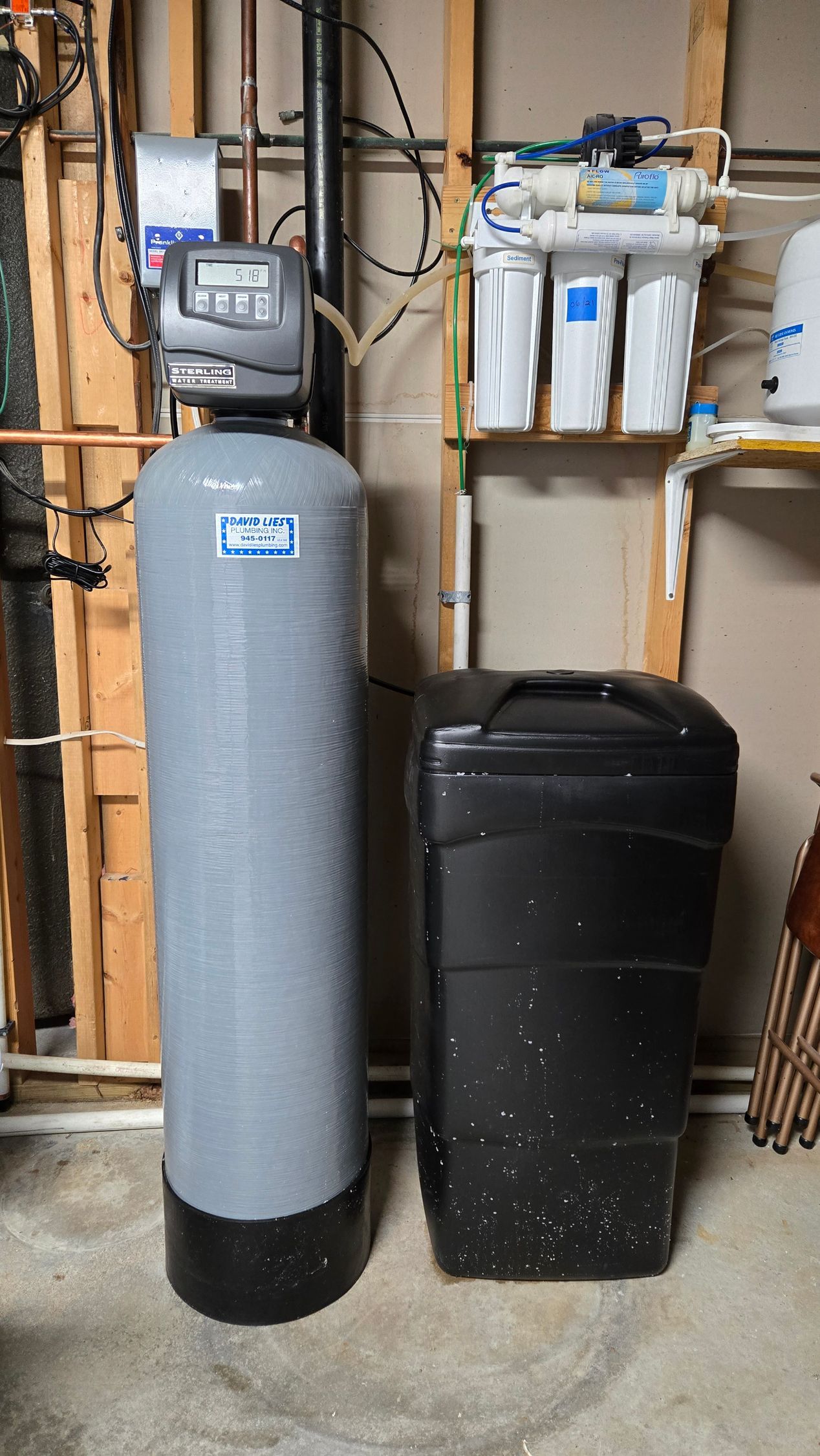 Water softener system and reverse osmosis filter in a utility room.