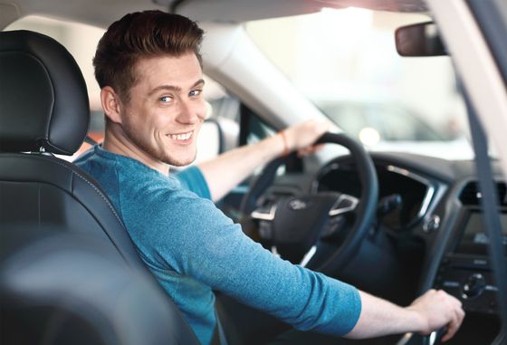 Smiling man driving