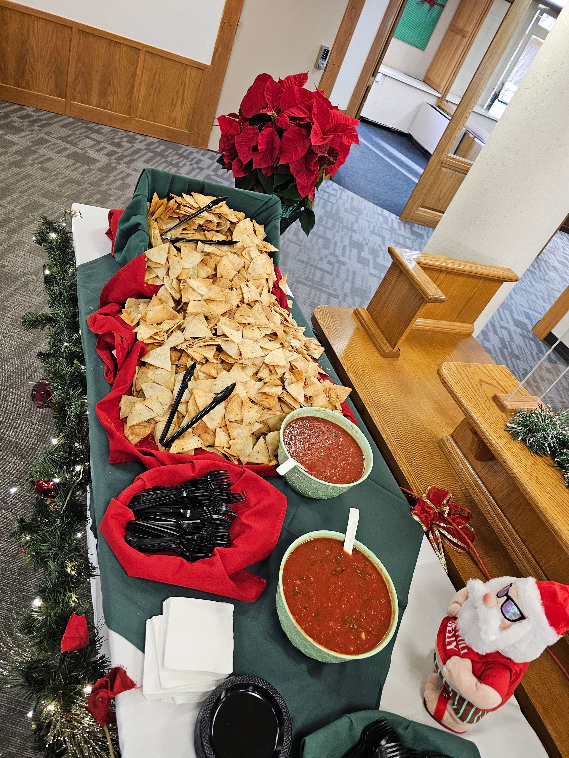 a buffet table with a santa claus figurine on it