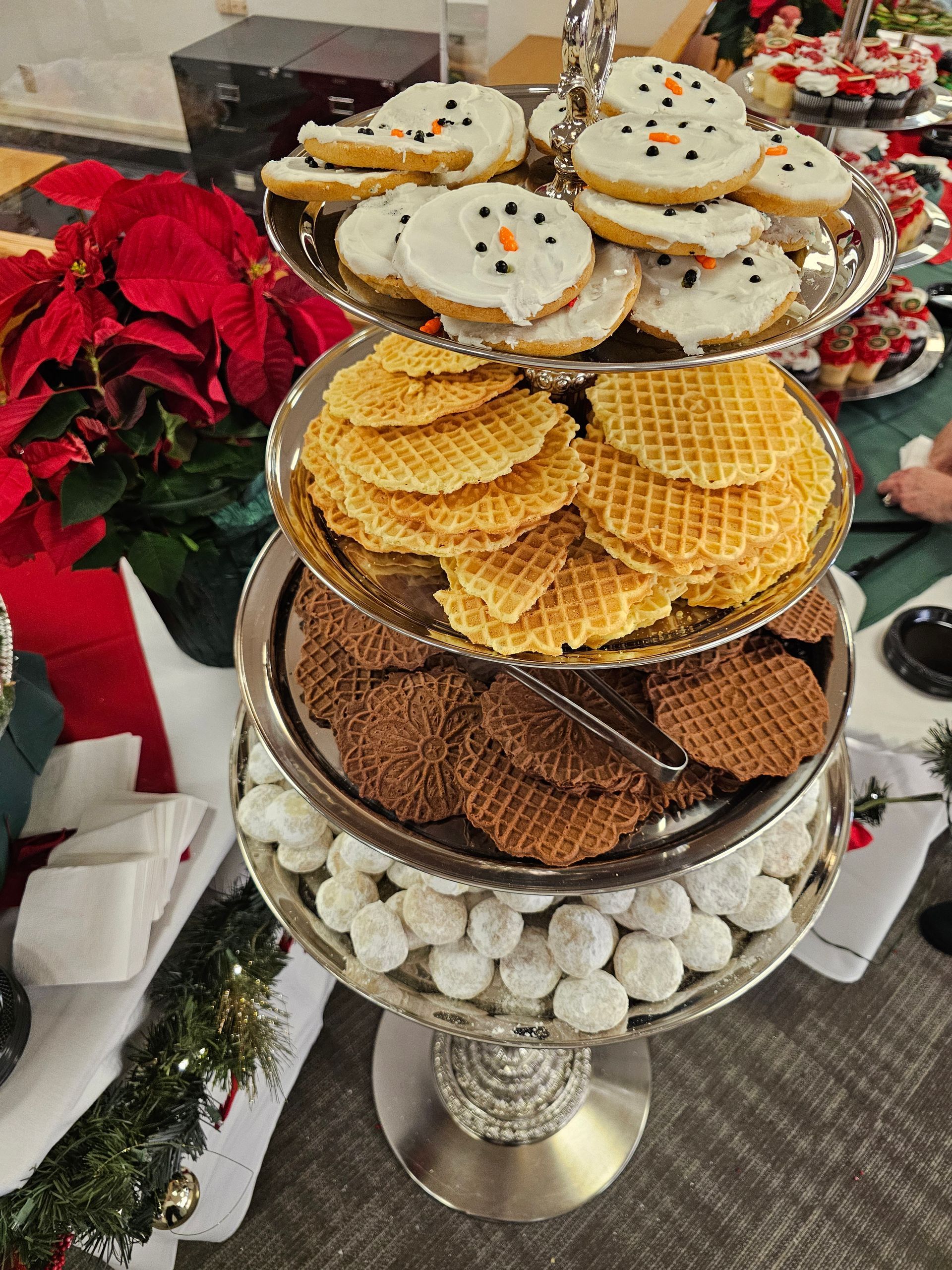 there are many different types of cookies on a tray on a table .