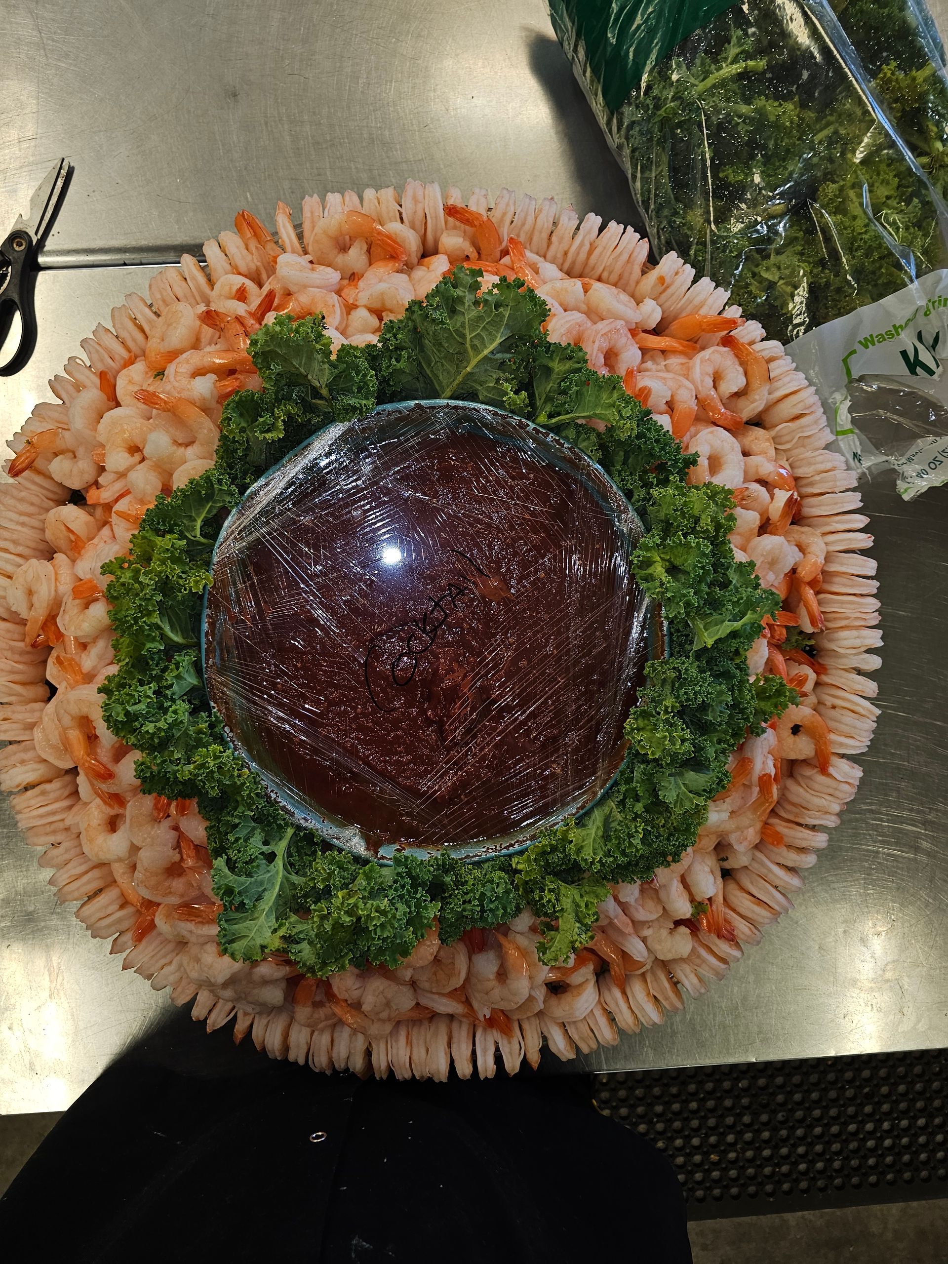 a plate of shrimp and sauce on a table