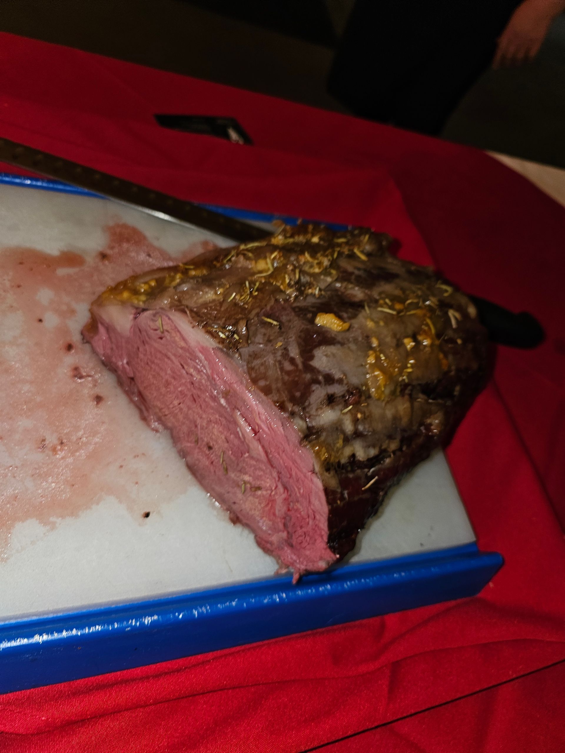 a piece of meat is being sliced on a cutting board