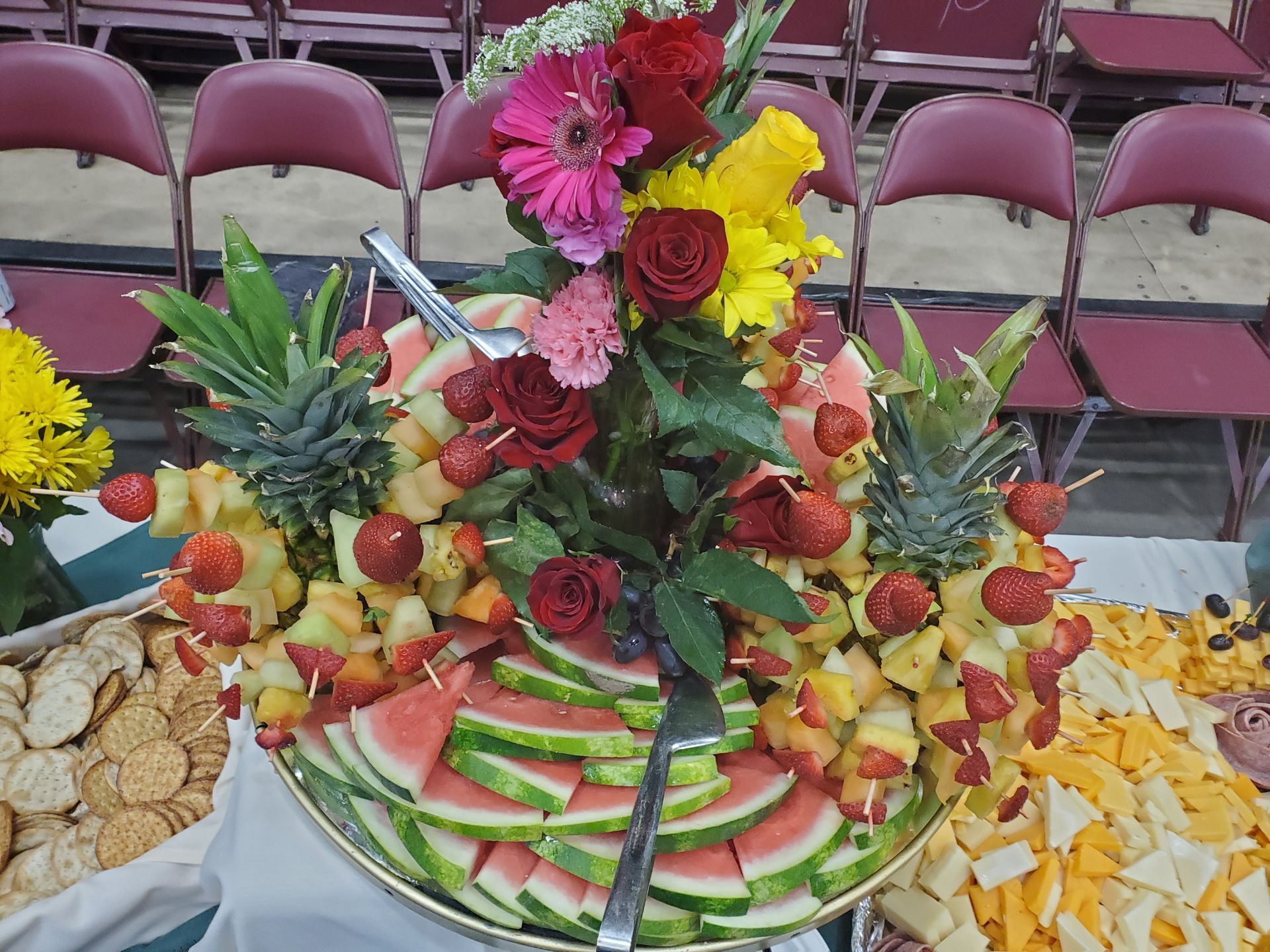 a tray of fruit including watermelon pineapple and strawberries