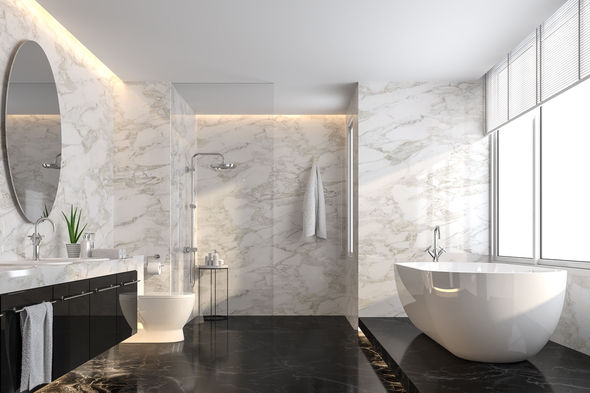 Luxurious bathroom with marble walls, black floor, soaking tub, large window, and modern fixtures.