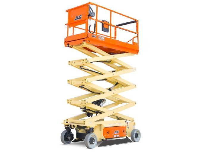 An orange scissor lift with wheels on a white background.