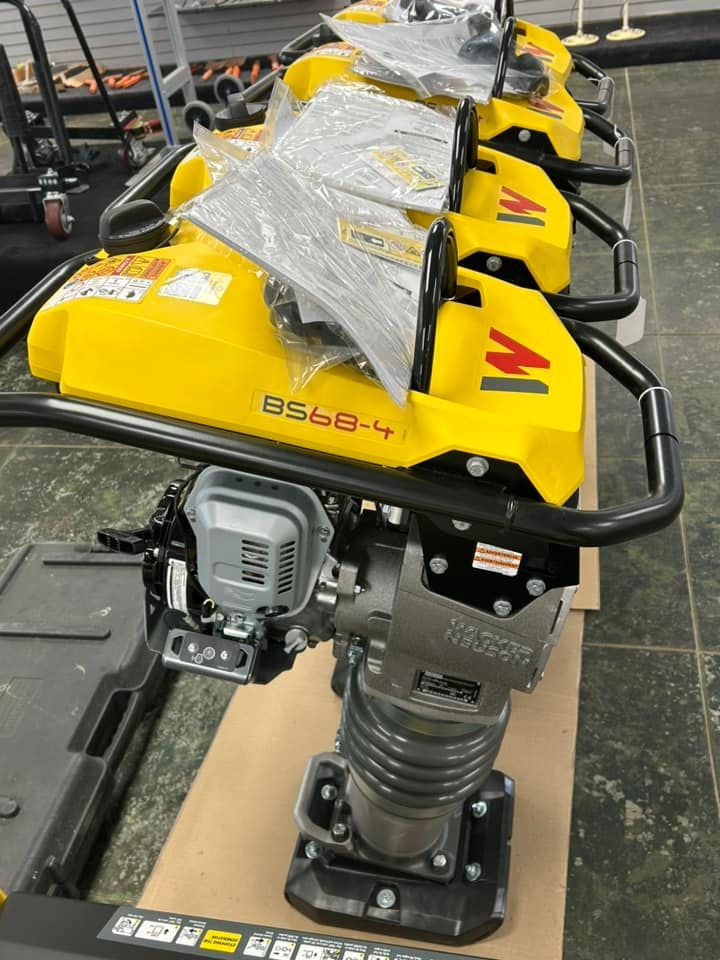 A row of yellow machines with the letter m on them