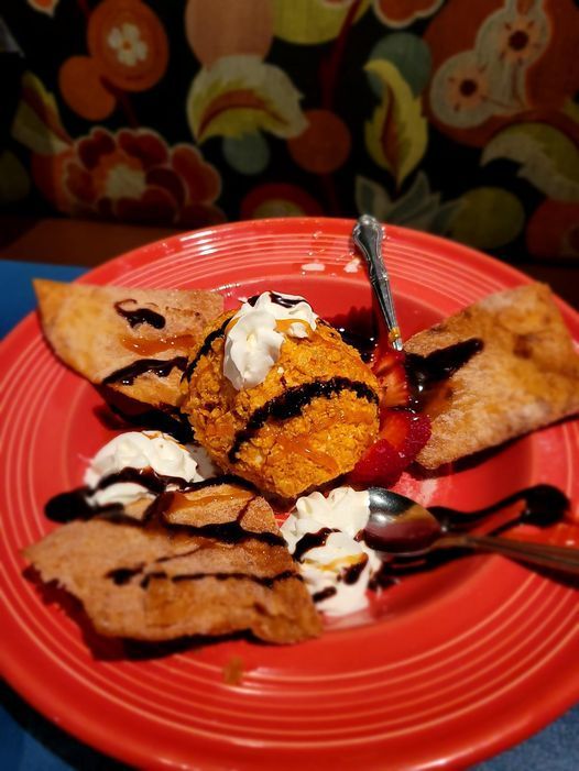 A close up of a plate of food with a spoon on it