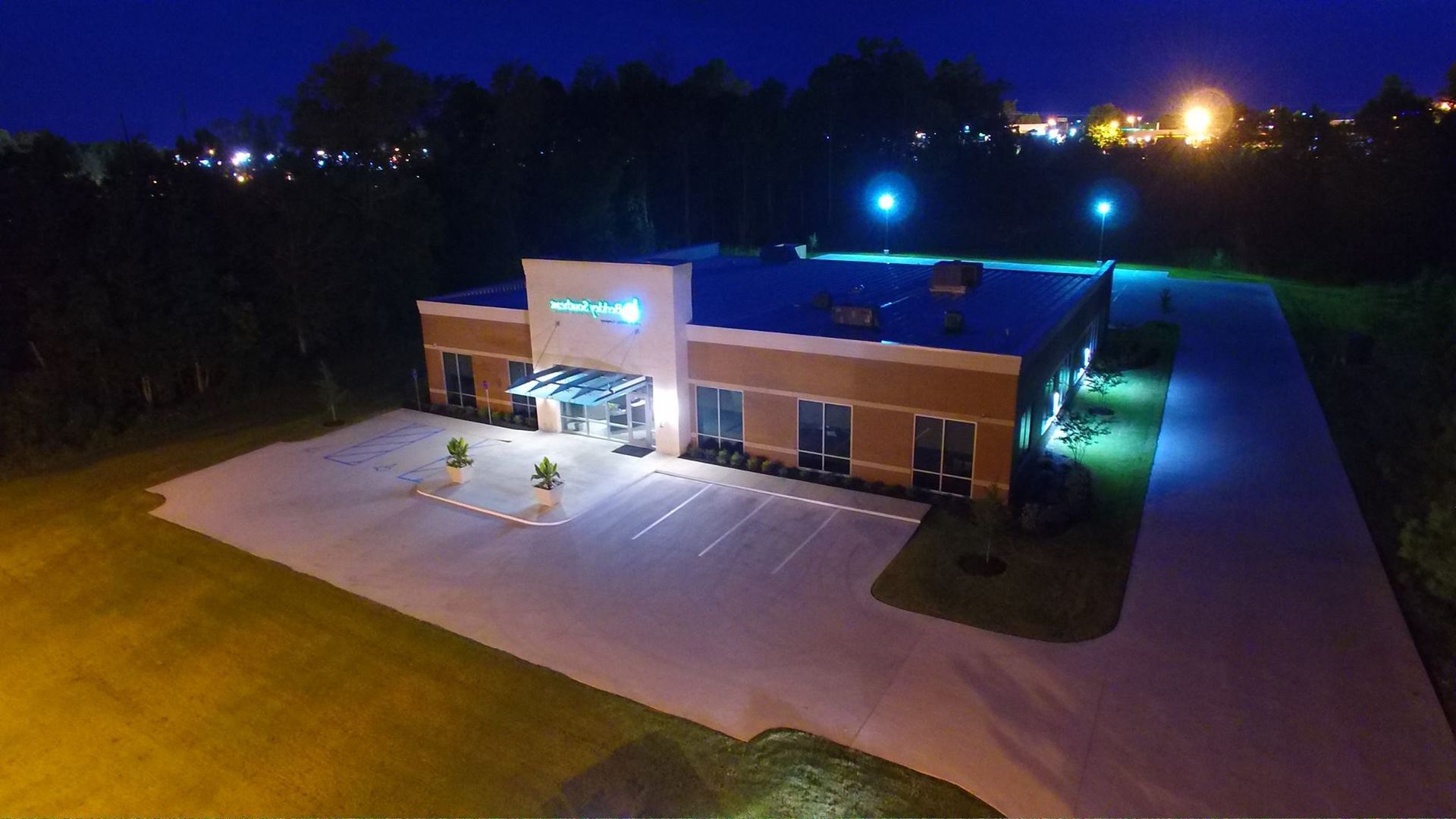 An aerial view of a large building at night.