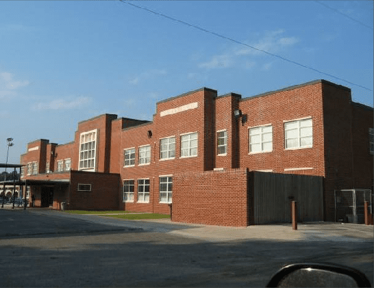 A large brick building with a lot of windows