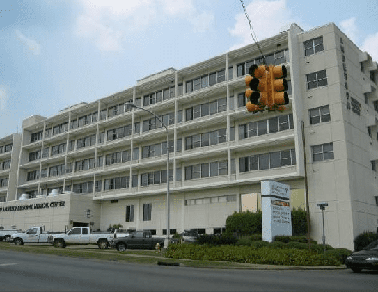 A large building with a traffic light on top of it