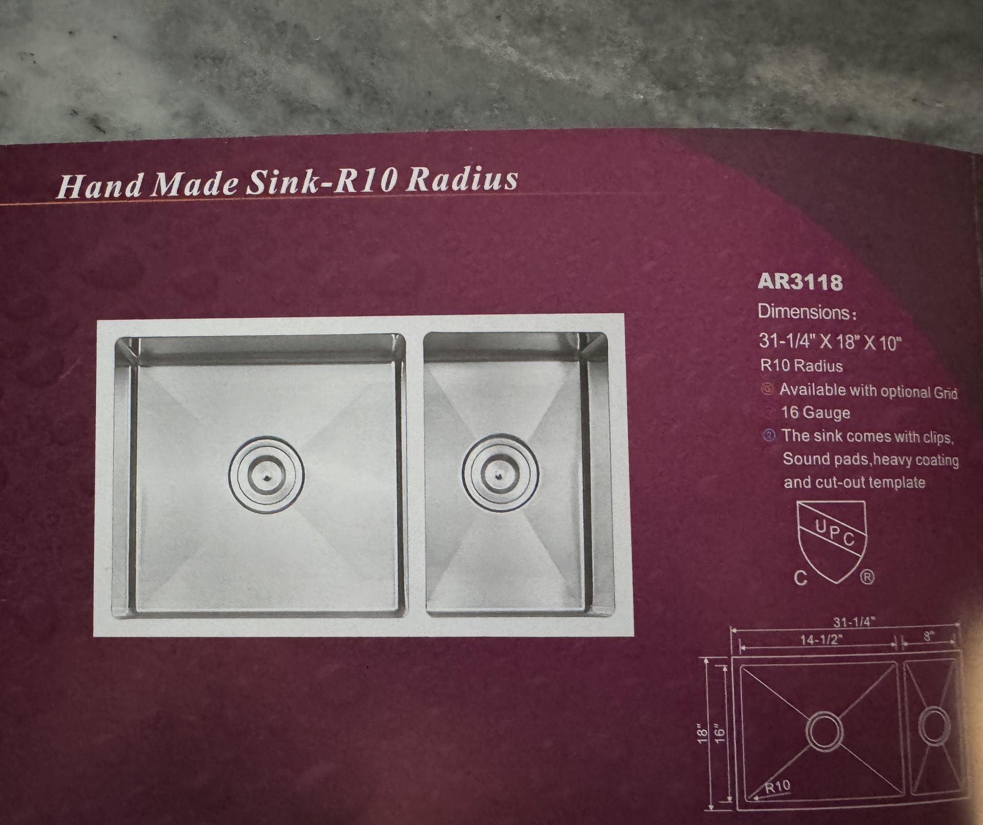 Stainless steel double sink with R10 radius. Features an inset design on a plum-colored background, with dimensions displayed.