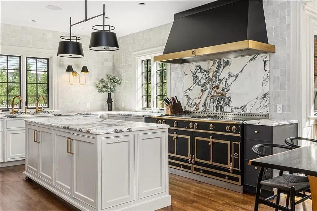 A kitchen with granite counter tops and wooden cabinets