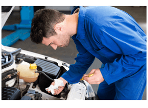 Mechanic changing oil