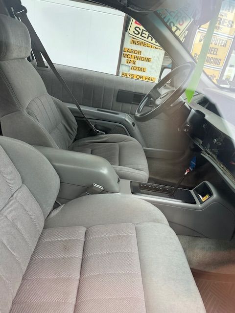 The inside of a car with a sign that says service